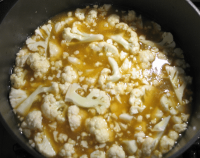 Cauliflower in pot with broth