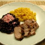 Mojo Criollo marinated pork, black beans, and yellow rice.