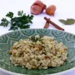 Israeli couscous with coconut milk, pine nuts, and parsley