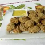 Homemade Baked Pecan Chicken Nuggets Bites with honey mustard dipping sauce
