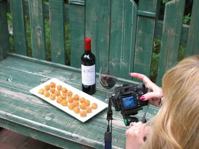 Photo of taking a photo of pimento cheese balls on a bench