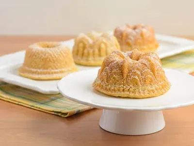 https://magnoliadays.com/wp-content/uploads/2013/01/Citrus-Cocktail-Mini-Bundt-Cakes.jpg.webp