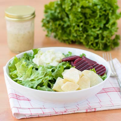 German-style salad with leaf lettuce, celeriac salad, beets, cucumber salad, and a light vinaigrette