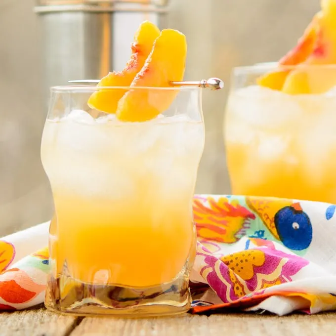 https://magnoliadays.com/wp-content/uploads/2014/12/Sparkling-Peach-Cocktail-2-680px.jpg.webp