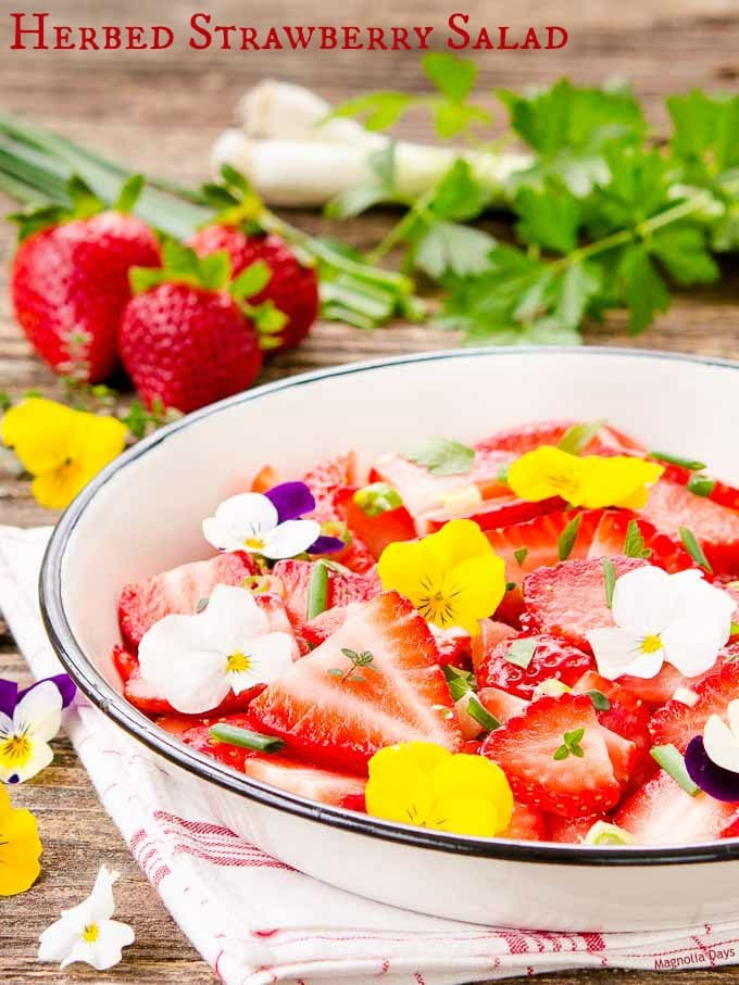 Herbed Strawberry Salad is a delightful mix of fresh strawberries, herbs, green onion, and herb dressing. It's a bowl of summer goodness.