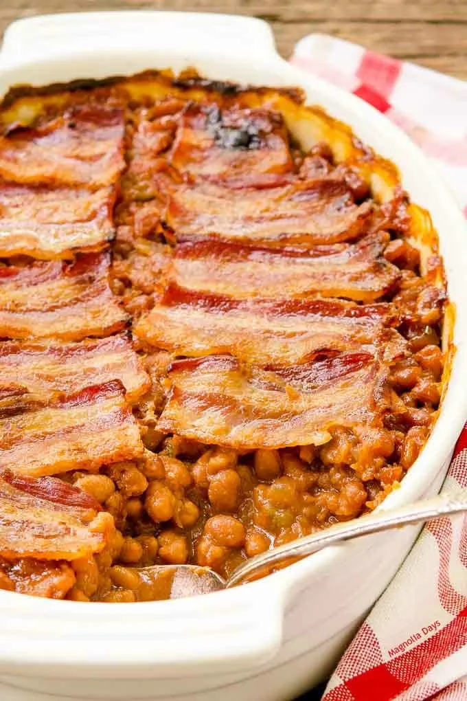 Baked Beans with bacon is a classic side dish popular at summer barbecues and potlucks. Serve it with burgers, ham, chicken, and BBQ pork.