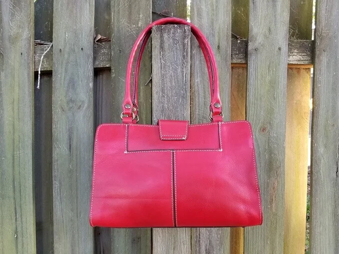 Patricia Nash Rienzo Satchel Back view hanging on a fence
