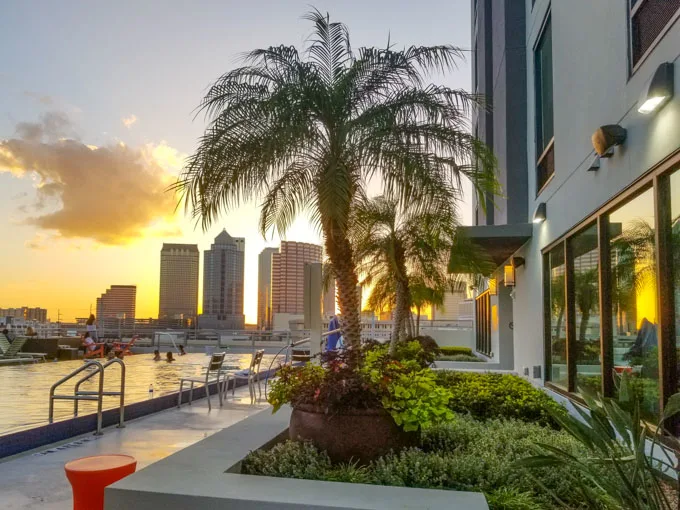 View of Tampa downtown sunset skyline from rooftop hotel pool at Home2 Suites